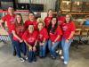 A group of All In employees volunteering at the Wiregrass Area Food Bank.